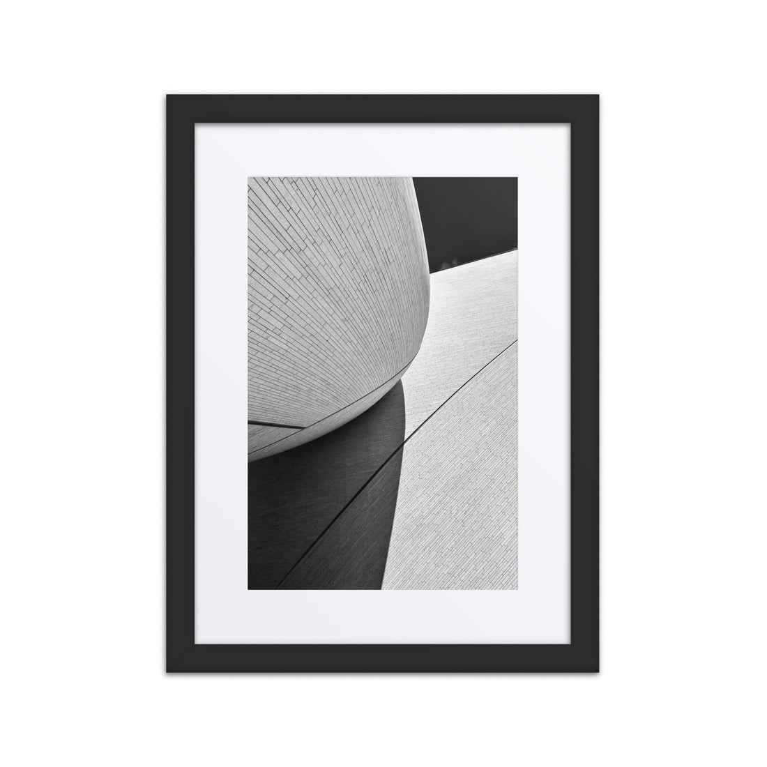 Black and white abstract architectural wall art in a black framed poster with mat