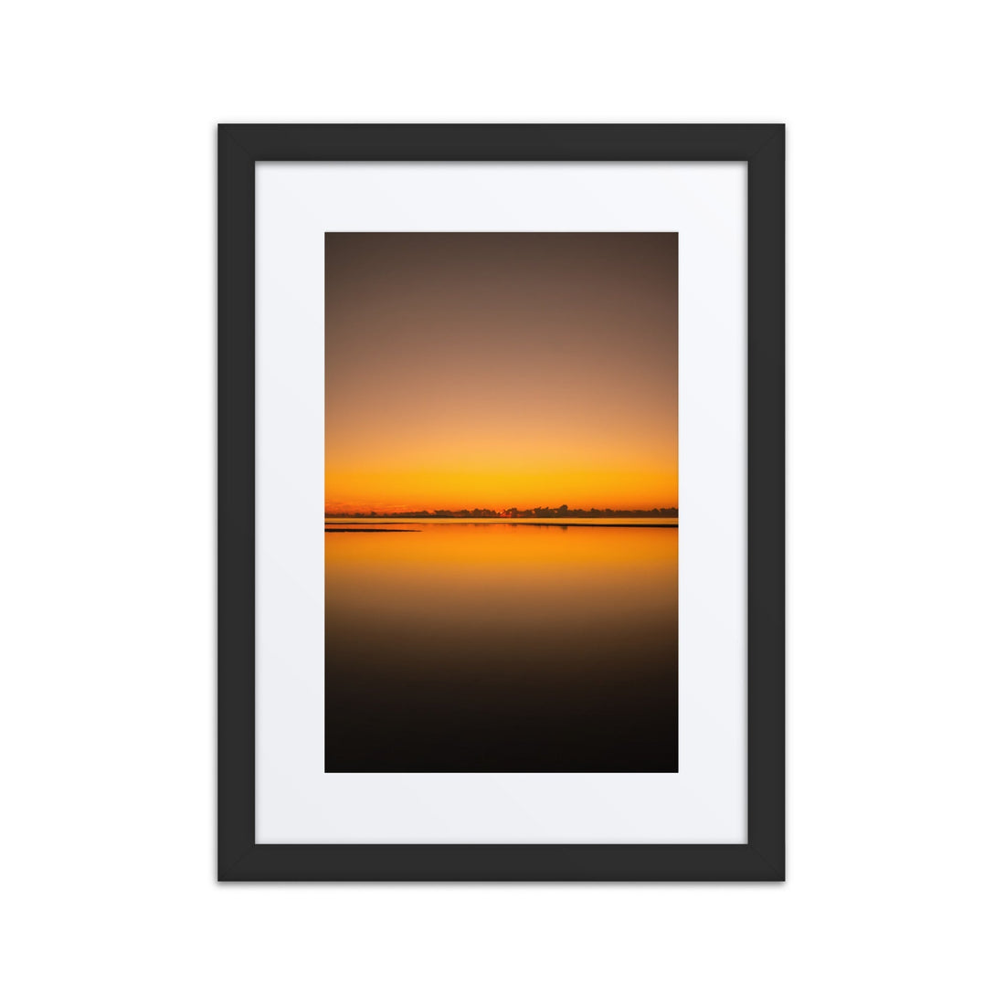 Minimalist framed sunset photography print with calm water reflection in black frame