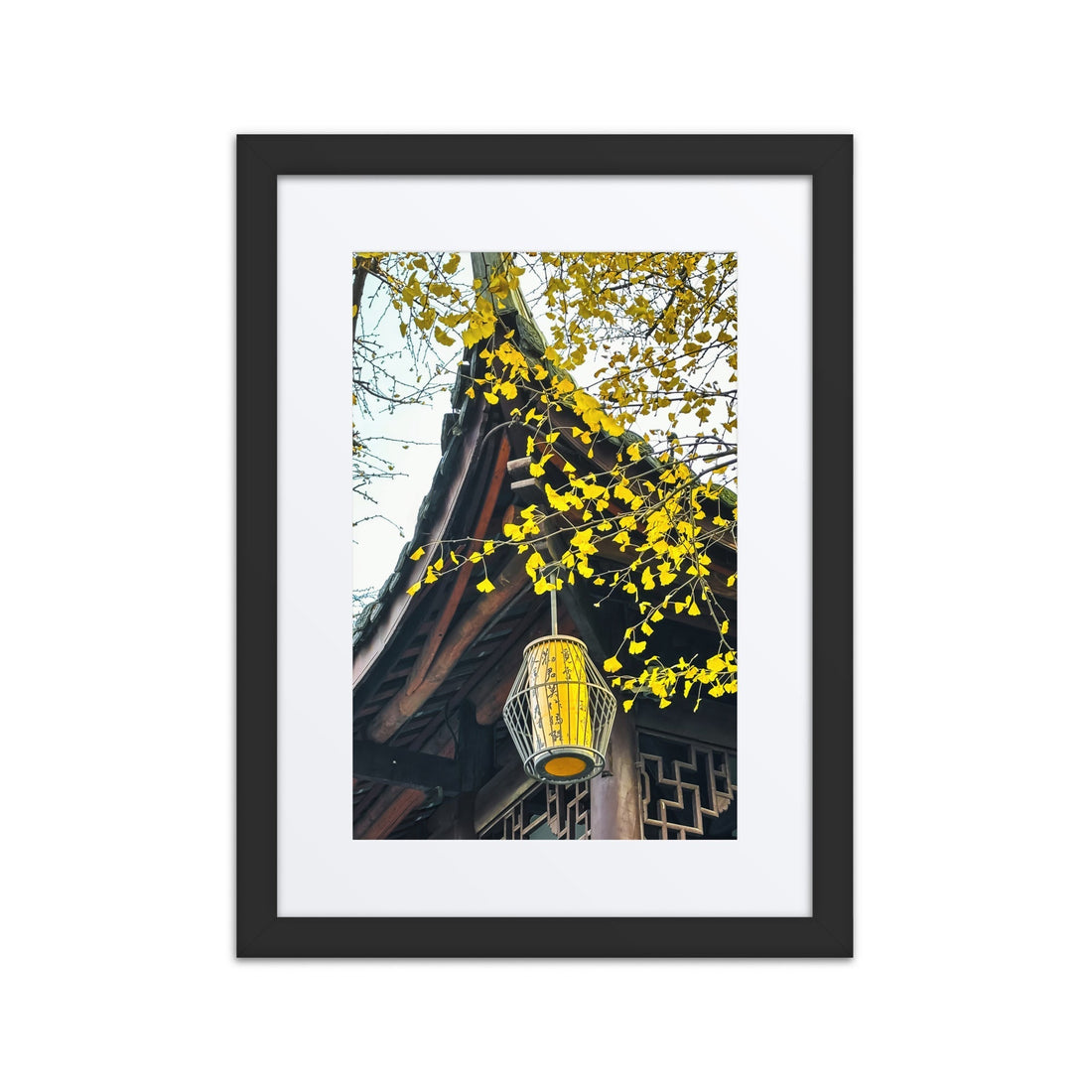 Framed poster of a traditional Asian roof, yellow lantern, and autumn leaves.